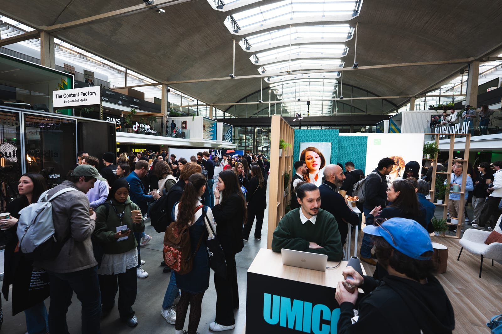 Dense crowd around the UMICO and Content Factory stands