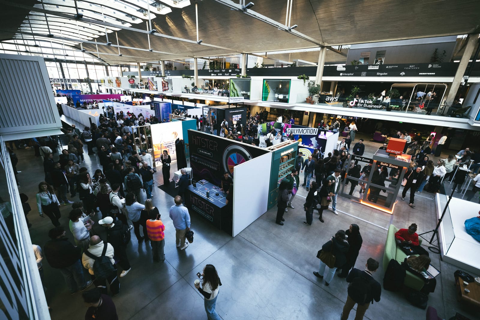 Aerial view of the venue with attendees flowing between the stands