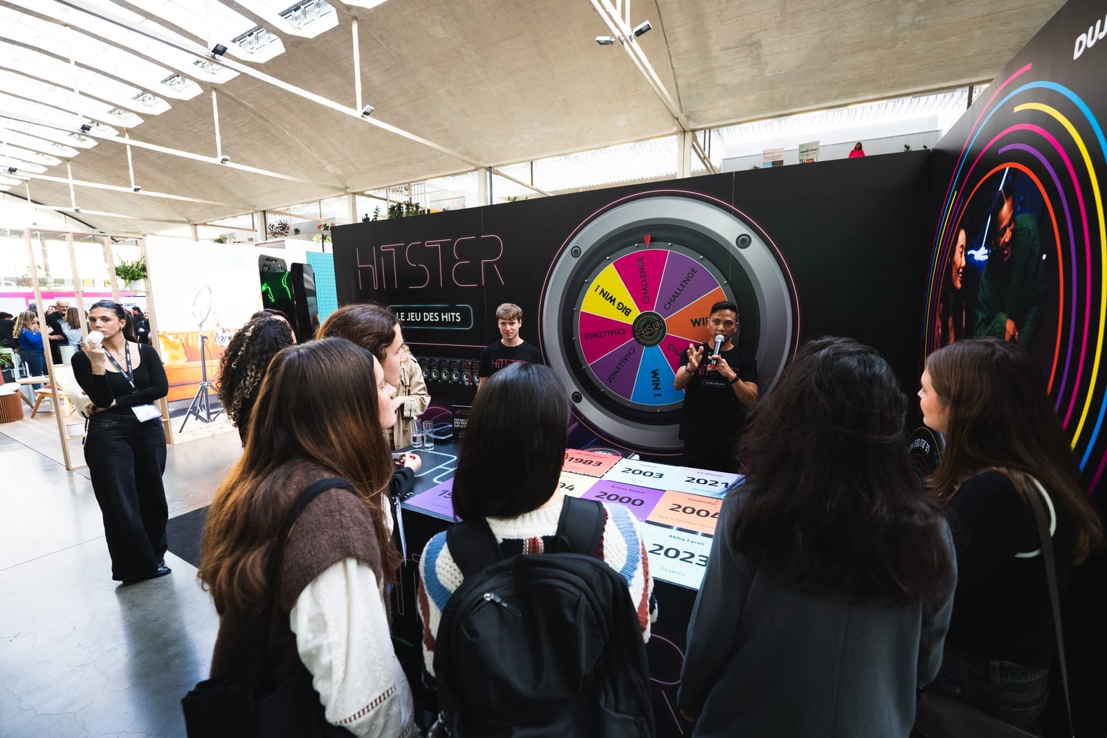 Crowd around the Hitster music game wheel