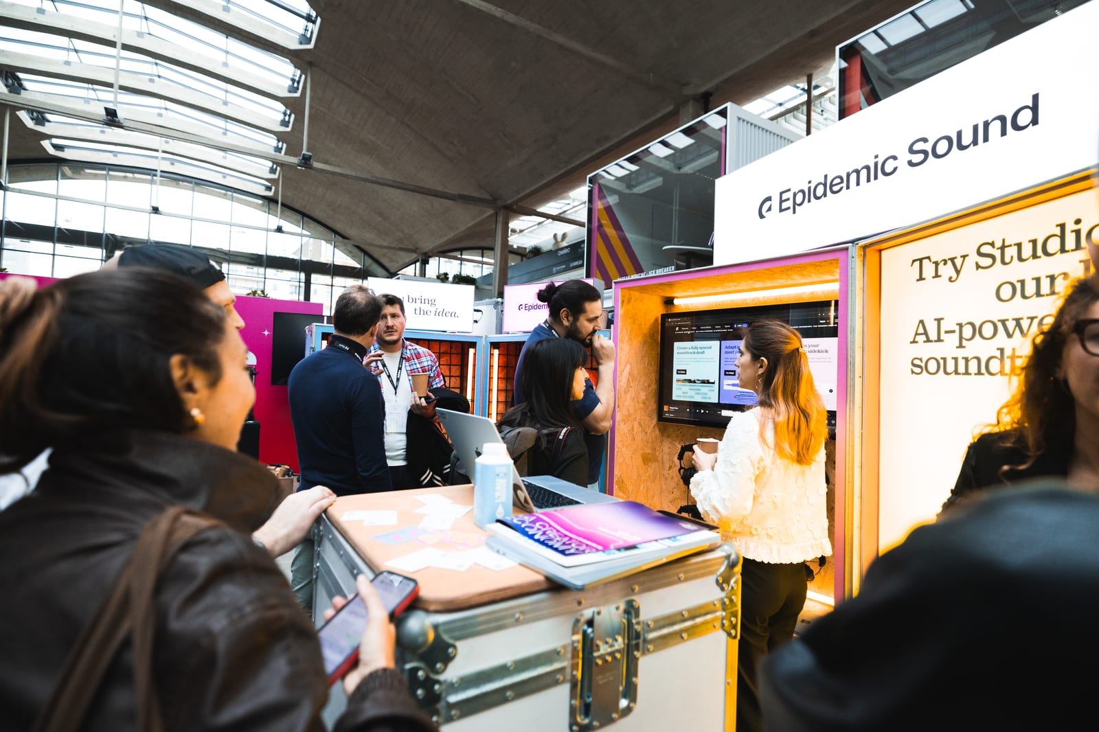 Attendees networking at the Epidemic Sound stand