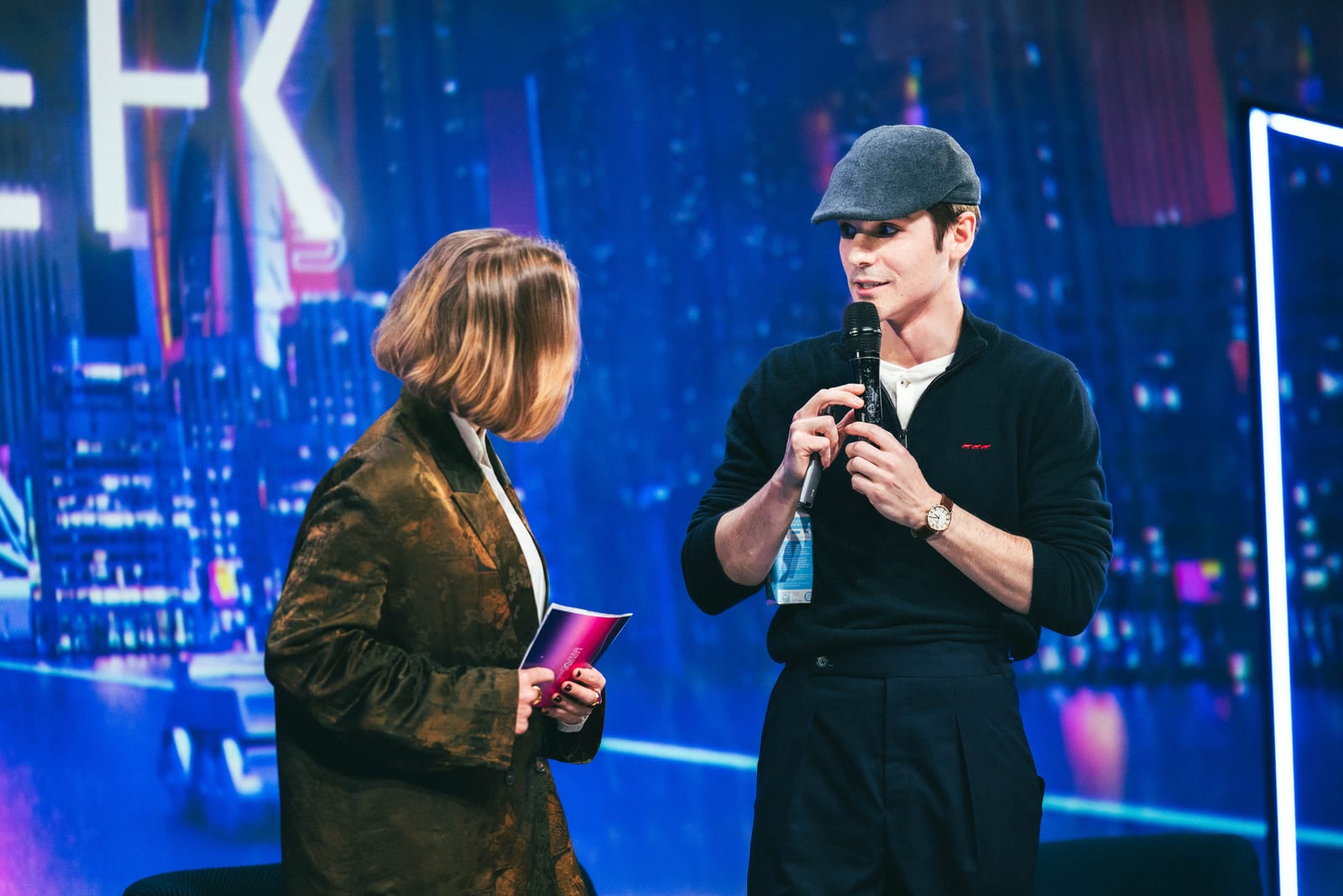 Interview on stage with a New York skyline backdrop